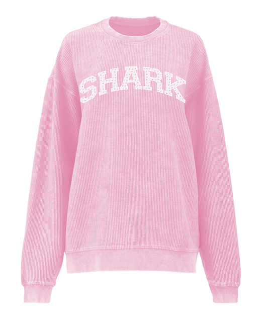 Pink sweatshirt with 'SHARK' text on a white background